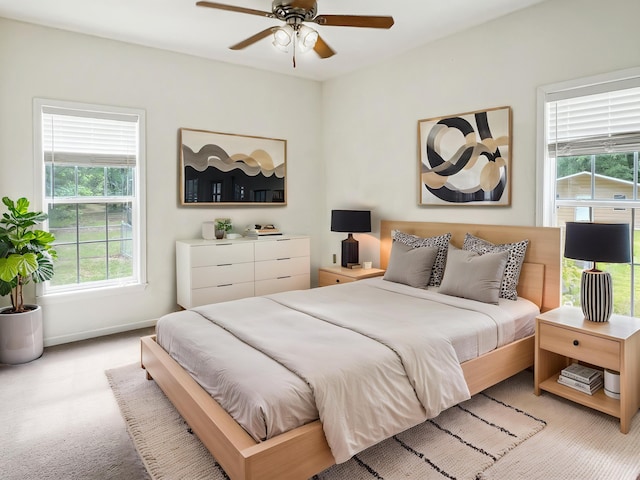 1514 Reevesville Rd, Bowman, SC 29018 - bedroom with multiple windows, light colored carpet, baseboards, and a ceiling fan