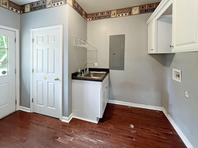 1514 Reevesville Rd, Bowman, SC 29018 - washroom featuring electric panel, washer hookup, dark wood-style floors, baseboards, and cabinet space