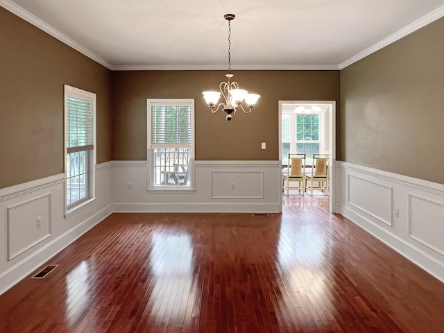 1514 Reevesville Rd, Bowman, SC 29018 - unfurnished dining area with a chandelier, hardwood / wood-style flooring, a wainscoted wall, and ornamental molding