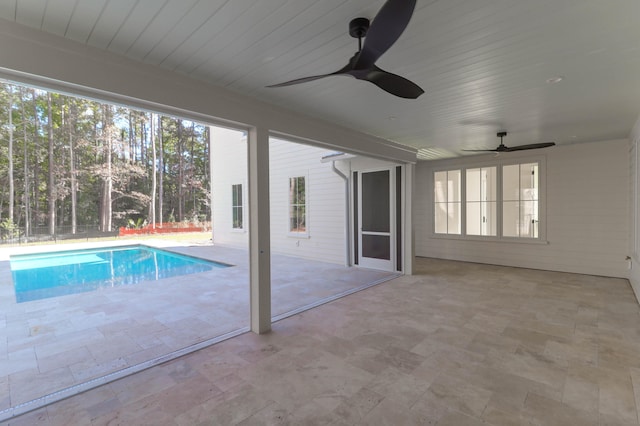 view of pool with ceiling fan and a patio