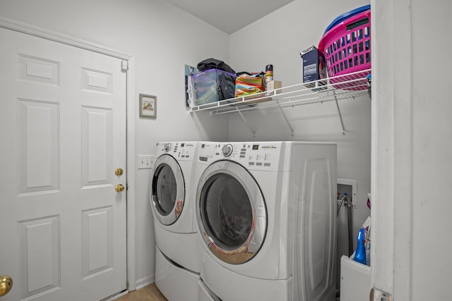 laundry area with laundry area and washer and clothes dryer