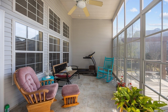 sunroom featuring ceiling fan