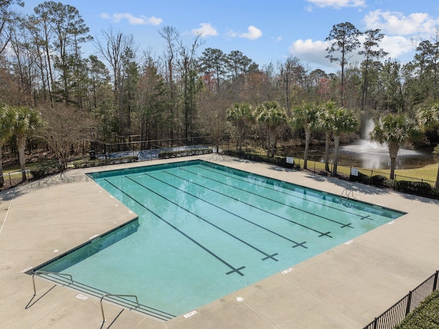 community pool featuring fence