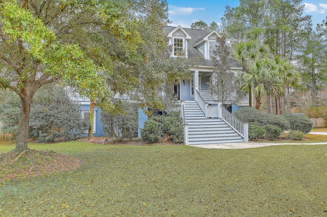 view of front facade featuring a porch and a front yard