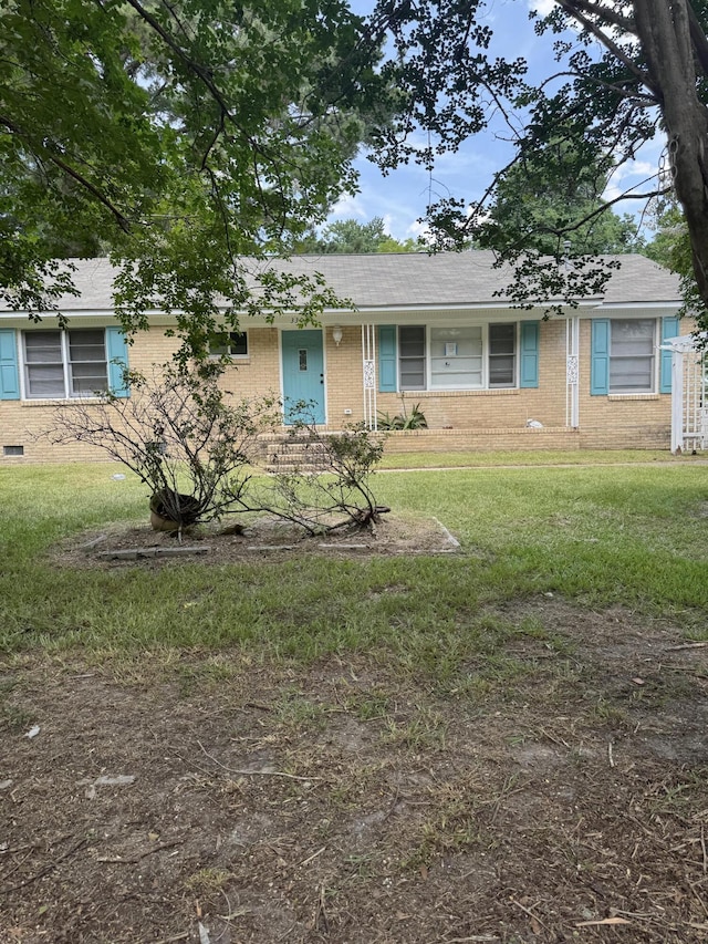 3308 Londonderry Rd, North Charleston, SC 29420 - ranch-style house featuring brick siding and a front yard