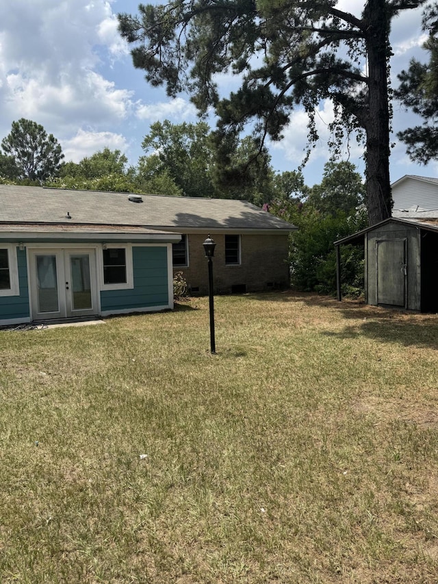 3308 Londonderry Rd, North Charleston, SC 29420 - view of green lawn with french doors and a storage unit