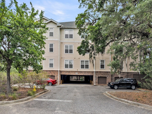 view of building exterior featuring a parking lot