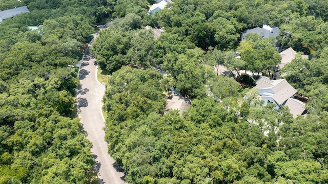 aerial view featuring a wooded view