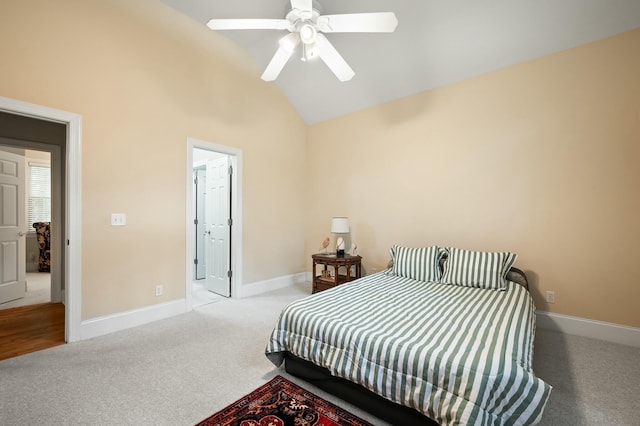 carpeted bedroom featuring high vaulted ceiling, baseboards, and a ceiling fan