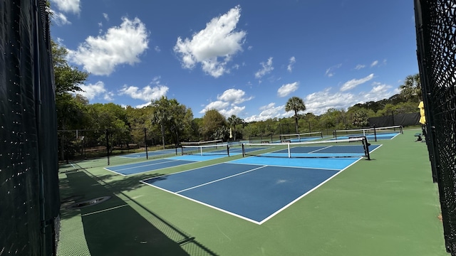 view of sport court with fence