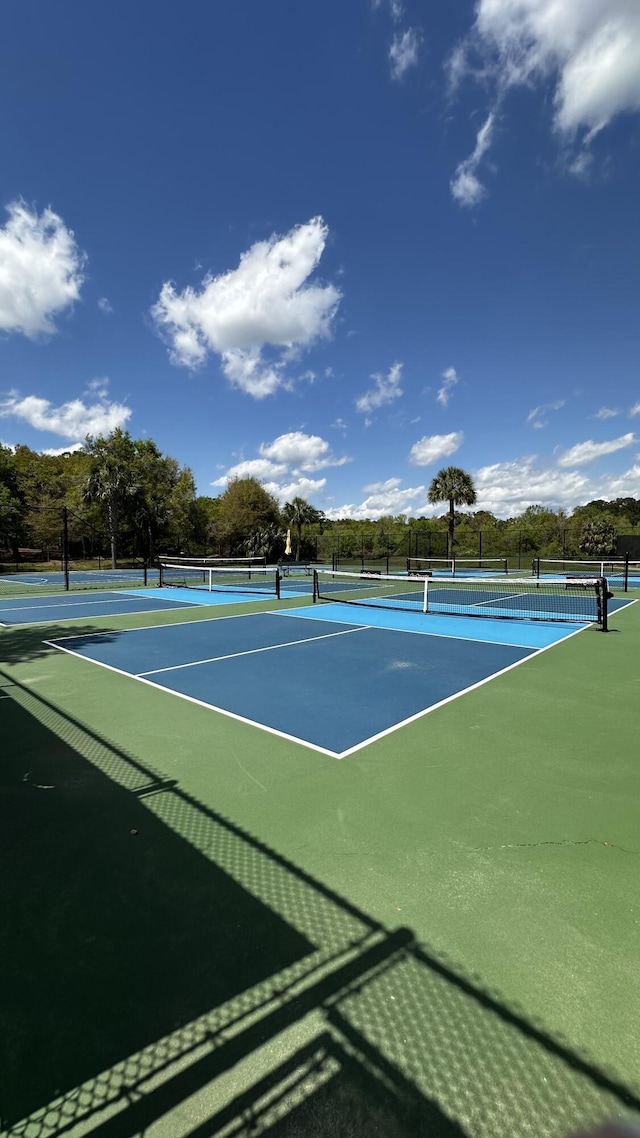 view of tennis court with fence