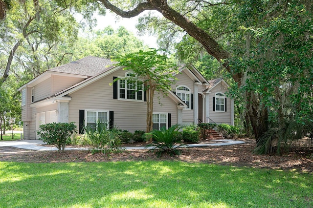 bi-level home with a front yard and driveway