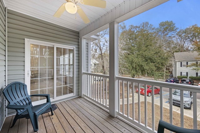 wooden terrace featuring ceiling fan