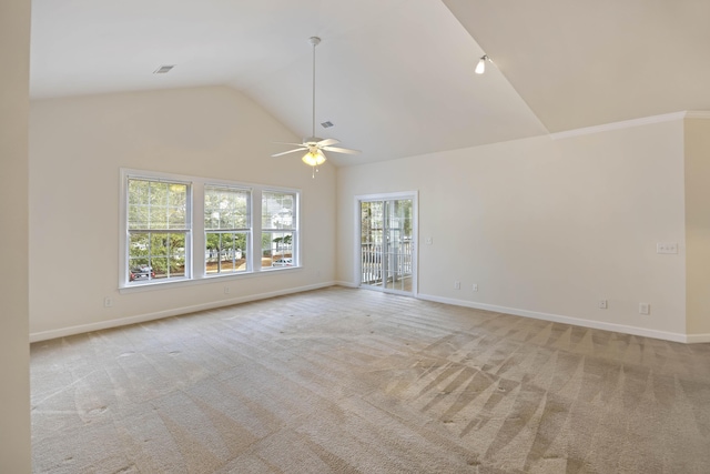 unfurnished living room with ceiling fan, light colored carpet, and vaulted ceiling