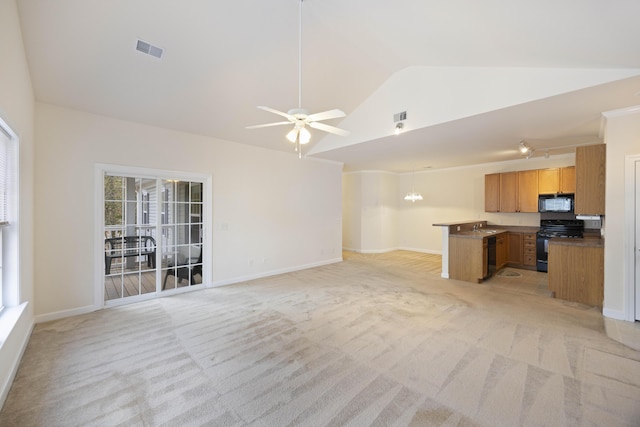 unfurnished living room featuring sink, ceiling fan, vaulted ceiling, and light colored carpet