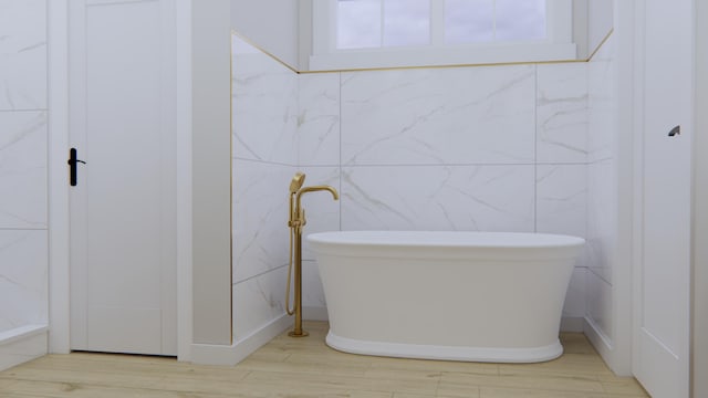 bathroom featuring hardwood / wood-style flooring and a bathtub