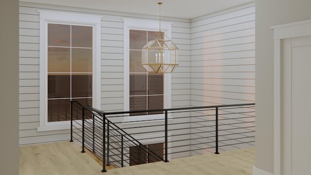 interior space featuring wood-type flooring and wood walls