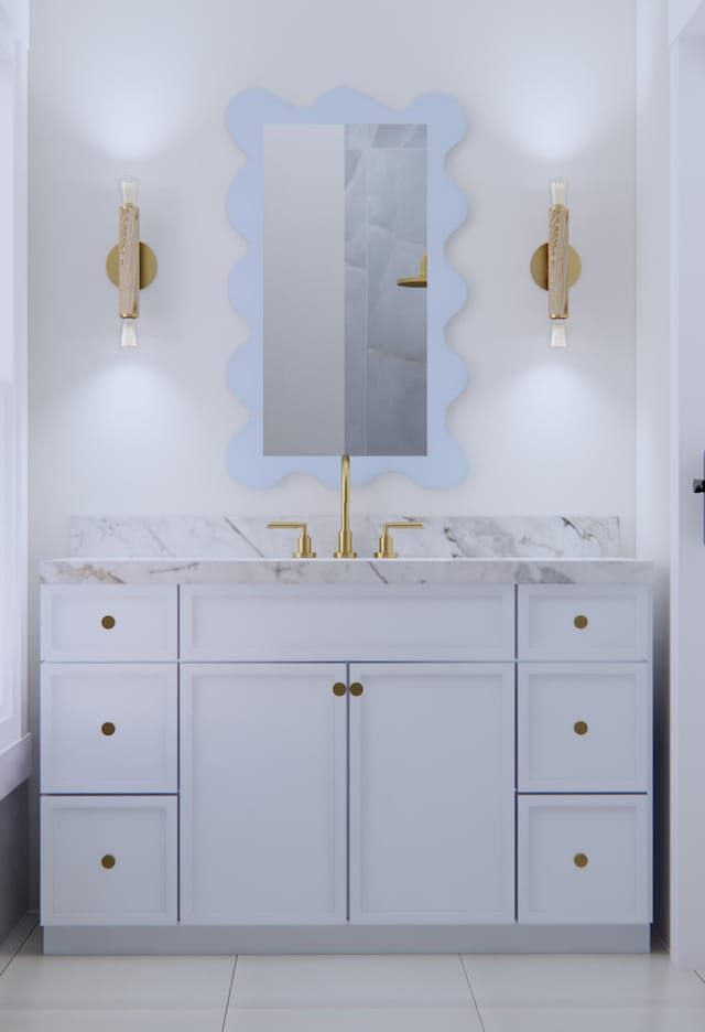 bathroom with tile patterned floors and vanity