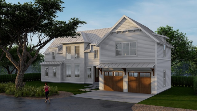 view of front of home with a front lawn and a garage