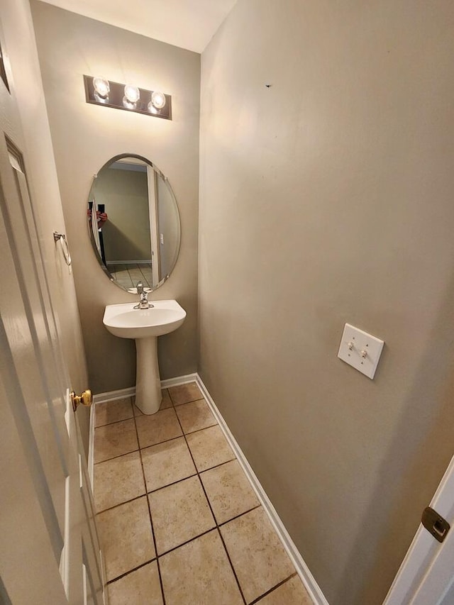 bathroom with tile patterned floors