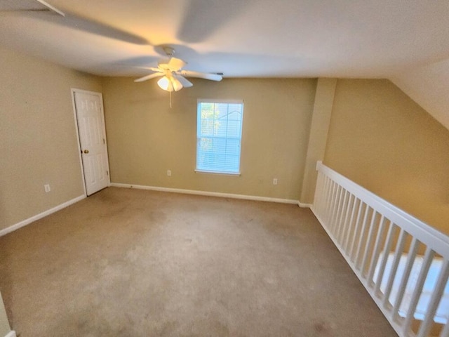 interior space featuring vaulted ceiling and ceiling fan