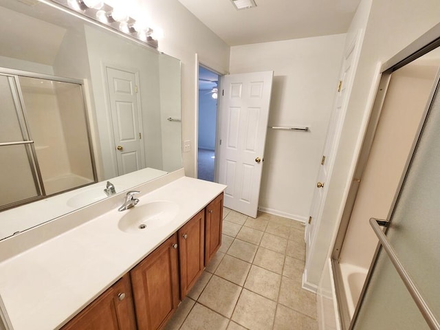 bathroom featuring vanity, tile patterned floors, ceiling fan, and a shower with shower door