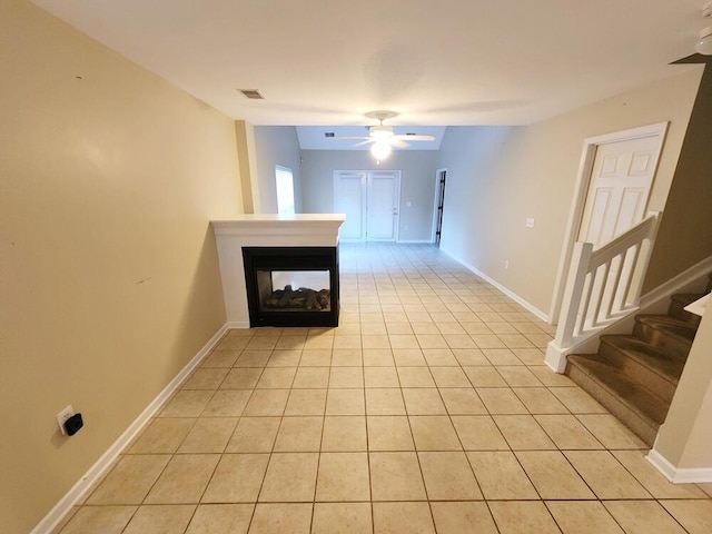 corridor featuring light tile patterned floors