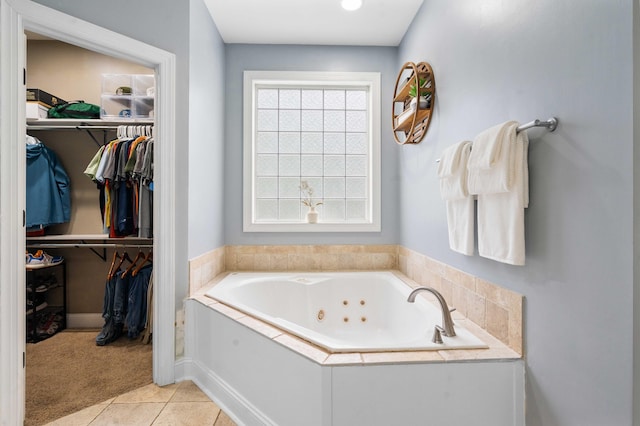 bathroom with tile patterned floors and a bathtub