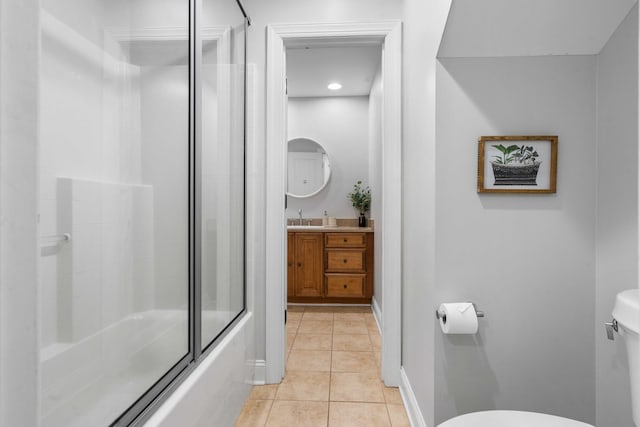 full bathroom featuring vanity, enclosed tub / shower combo, tile patterned floors, and toilet