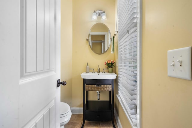 bathroom with tile patterned floors, toilet, and sink