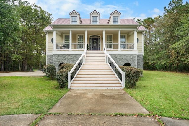 view of front of property featuring a front lawn and covered porch