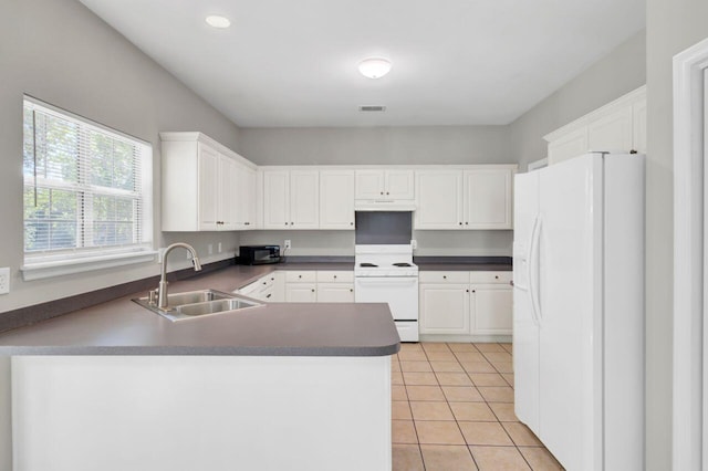 434 Antebellum Ln, Mount Pleasant, SC 29464 - kitchen featuring white appliances, a sink, a peninsula, white cabinetry, and dark countertops