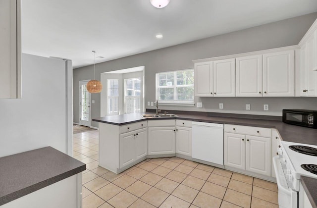 434 Antebellum Ln, Mount Pleasant, SC 29464 - kitchen featuring white appliances, dark countertops, a sink, white cabinets, and light tile patterned floors