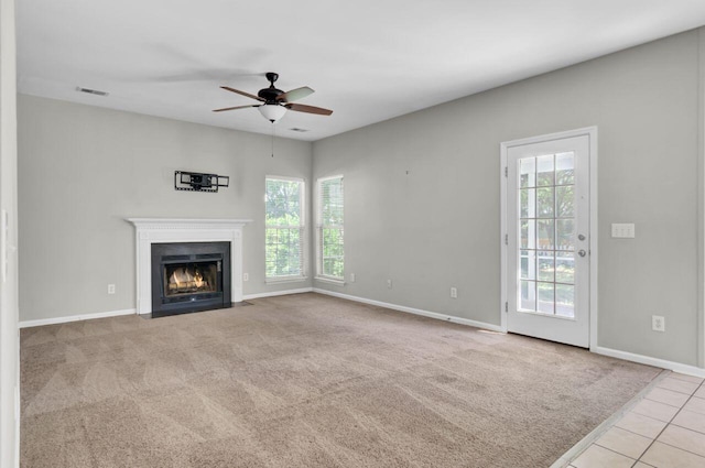 434 Antebellum Ln, Mount Pleasant, SC 29464 - unfurnished living room featuring ceiling fan, baseboards, a fireplace with flush hearth, carpet floors, and tile patterned floors