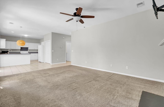 434 Antebellum Ln, Mount Pleasant, SC 29464 - unfurnished living room with light carpet, a ceiling fan, a sink, baseboards, and light tile patterned flooring