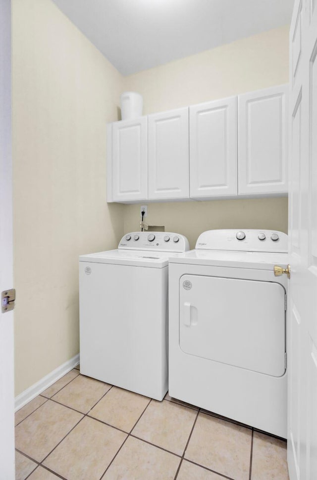 434 Antebellum Ln, Mount Pleasant, SC 29464 - washroom with cabinet space, washer and dryer, light tile patterned floors, and baseboards