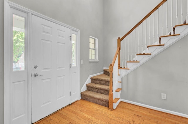 434 Antebellum Ln, Mount Pleasant, SC 29464 - foyer with healthy amount of natural light, hardwood / wood-style flooring, stairs, baseboards, and a high ceiling