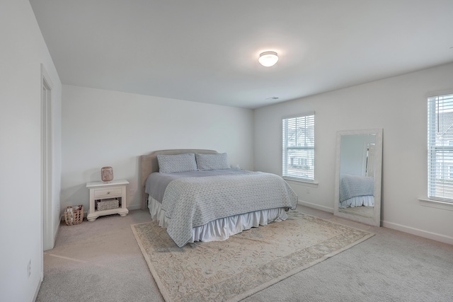 bedroom with light colored carpet