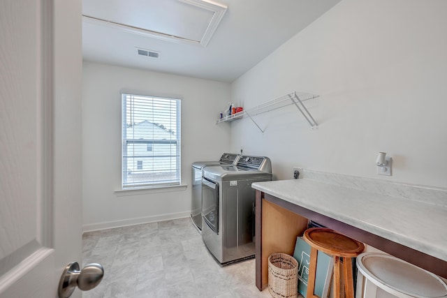 laundry room featuring washing machine and dryer