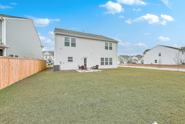 back of property featuring central AC, a yard, and a patio