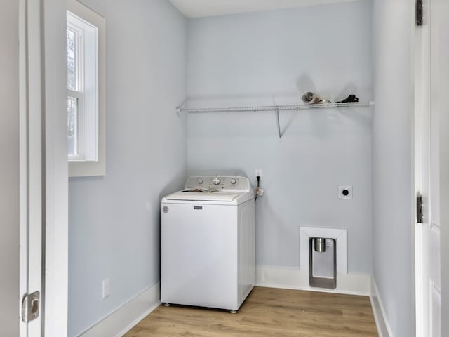 washroom with washer / dryer and light wood-type flooring