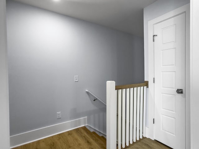 stairs featuring hardwood / wood-style flooring