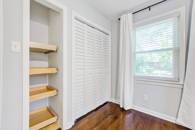 5043 Victoria Ave, North Charleston, SC 29405 - unfurnished bedroom featuring dark wood finished floors, baseboards, and a closet