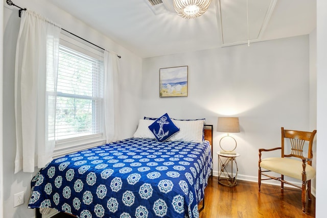 5043 Victoria Ave, North Charleston, SC 29405 - bedroom featuring attic access, multiple windows, wood finished floors, and baseboards