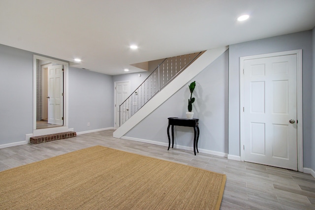 5043 Victoria Ave, North Charleston, SC 29405 - finished below grade area featuring light wood finished floors, baseboards, stairs, and recessed lighting