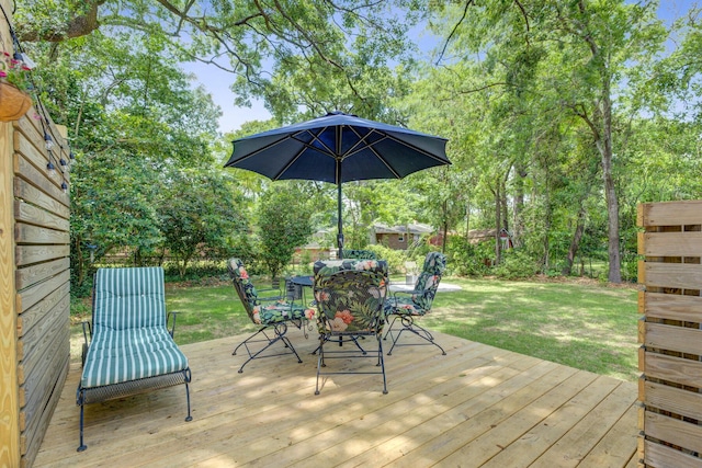 5043 Victoria Ave, North Charleston, SC 29405 - deck with outdoor dining area and a yard