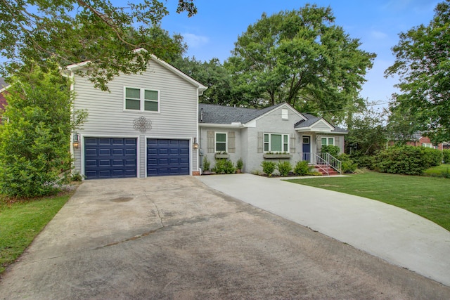5043 Victoria Ave, North Charleston, SC 29405 - view of front of house with concrete driveway, an attached garage, and a front lawn