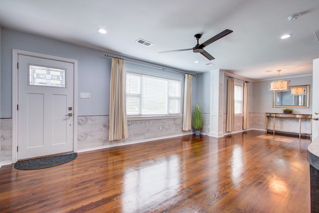 5043 Victoria Ave, North Charleston, SC 29405 - unfurnished living room featuring a wainscoted wall, wood finished floors, a ceiling fan, recessed lighting, and a chandelier