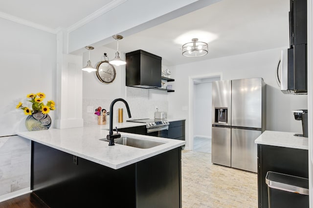 5043 Victoria Ave, North Charleston, SC 29405 - kitchen with appliances with stainless steel finishes, dark cabinets, a peninsula, a sink, and backsplash
