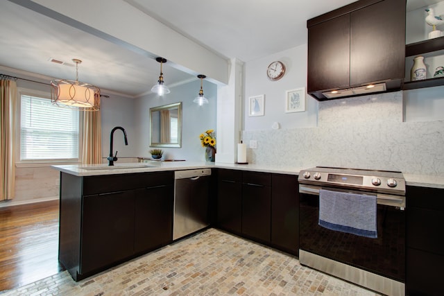 5043 Victoria Ave, North Charleston, SC 29405 - kitchen with appliances with stainless steel finishes, a peninsula, a sink, healthy amount of natural light, and ornamental molding